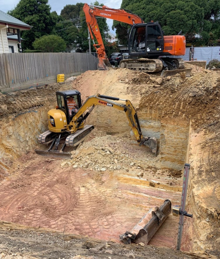 Upmost excavators preparing a residential construction site in Michigan